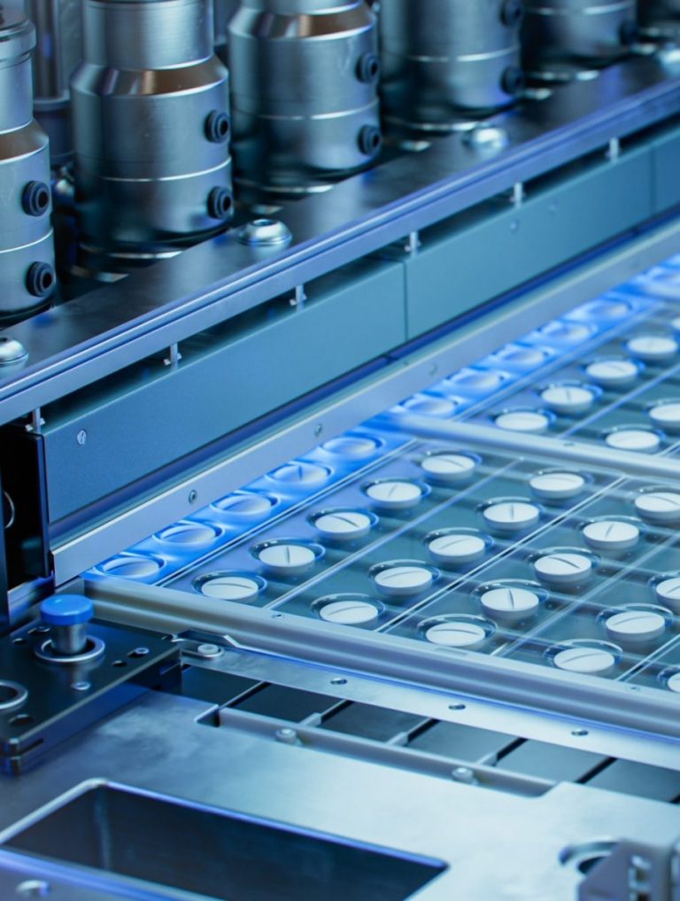 Close-up Shot of White Pills During Production and Packing Process